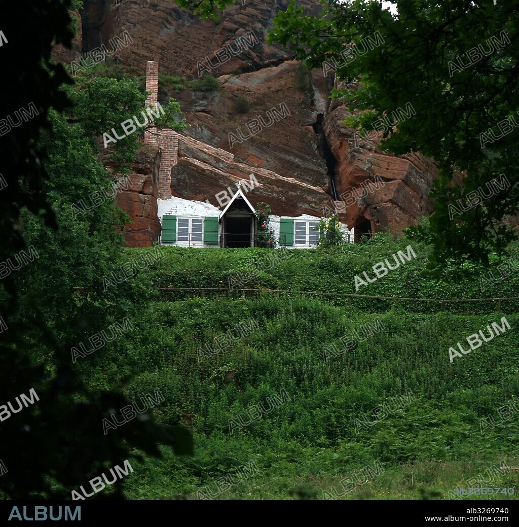 Kinver Edge is home to the last troglodyte dwellings occupied in England. The cave-houses excavated into the local sandstone. One of the rocks, 'Holy Austin', was a hermitage until the Reformation. The Holy Austin rock houses were inhabited until the 1960s. They are now owned by the National Trust. Kinver Edge is on the border between Worcestershire and Staffordshire, England.