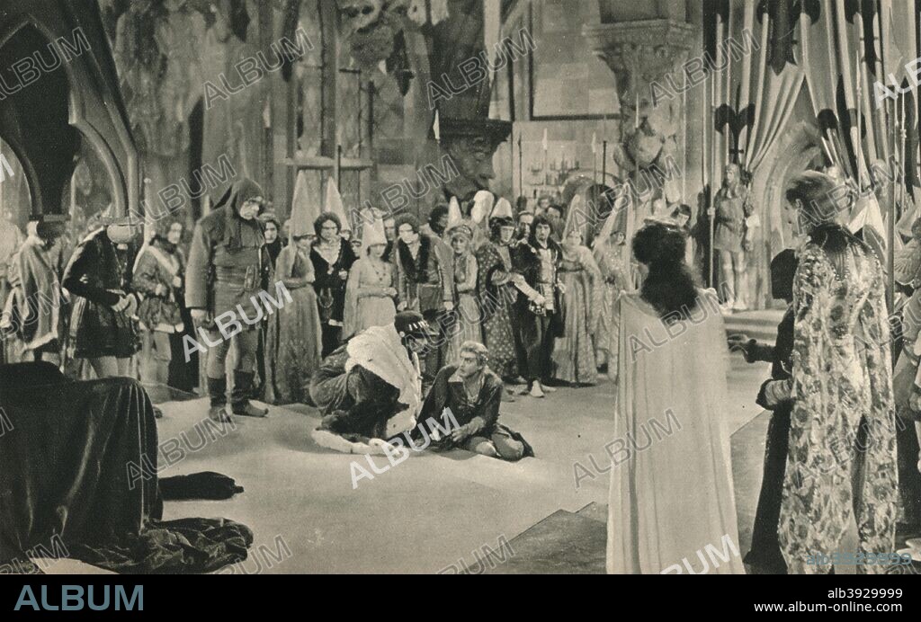 'Villon (John Barrymore) threatened with death by Louis XI. (Conrad Veidt). From the film: The Beloved Rogue. Settings by William Cameron Menzies', 1927. The Beloved Rogue is a silent film directed by Alan Crosland. From The Studio Volume 93. [London Offices of the Studio, London, 1927].