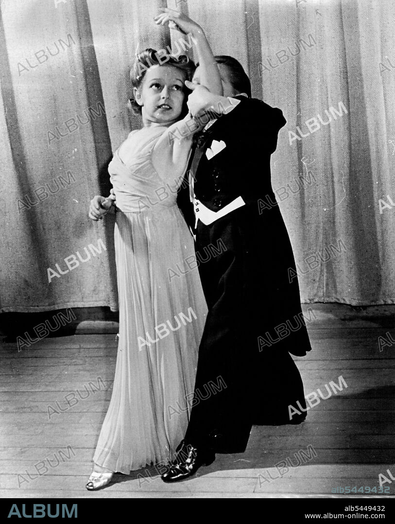 Jerry/Diminutive Dancers Are Popular Entertainers.Here are Olive and George Brasno, popular midget entertainers. George, who is 28 year of age, weighs 50 Pounds; Olive, who is 22, weighs 48 pounds. Both are about forty inches high. They were barn in New Jersey and still reside there between engagements, on their own tarn but outside new Brunswick. They have appeared in leading theatres, cafes, and hotels in the United States, Canada, England, France, Germany and Australia. Photo taken in New York shows then performing one of their popular dance numbers. June 15, 1940. (Photo by Jerry Cooke, Pix Publishing, Inc.).