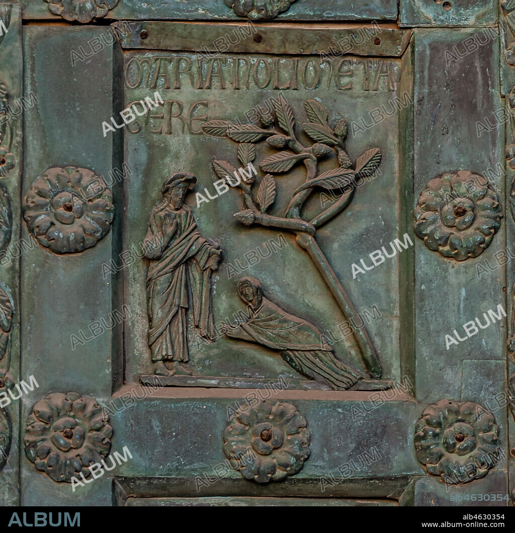 Monreale Cathedral, the gate by Bonanno Pisano (1185-6): bronze tile depicting "Noli Me Tangere" (scene of the New Testament).. The gate is signed "Bonanno civis pisanus". It depicts five scenes of the Old Testament at the bottom, starting with Adam and Eve, and five scenes of the New Testament at the top, ending in "Christ and Mary in the glory of Paradise".