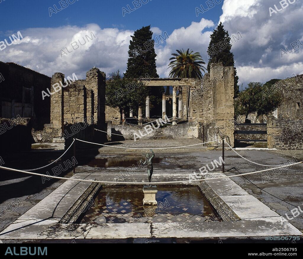 Roman Art. Italy. Pompeii. The House of the Faun. Built during the 2nd century BC. Private residence. Bronze statue of the dancing faun located, originally, on the lip of the impluvium.