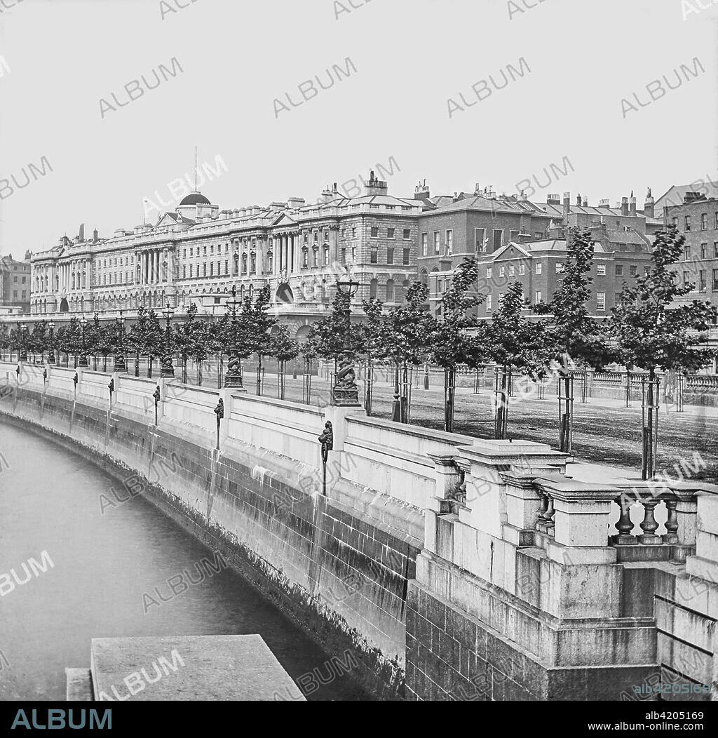 Magic lantern slide circa 1900.Victorian.Social History.Somerset House is a large Neoclassical building situated on the south side of the Strand in central London, overlooking the River Thames, just east of Waterloo Bridge. The building, originally the site of a Tudor palace, was designed by Sir William Chambers in 1776, and further extended with Victorian wings to the east and west in 1831 and 1856 respectively.The East Wing forms part of the adjacent Strand campus of King's College London.