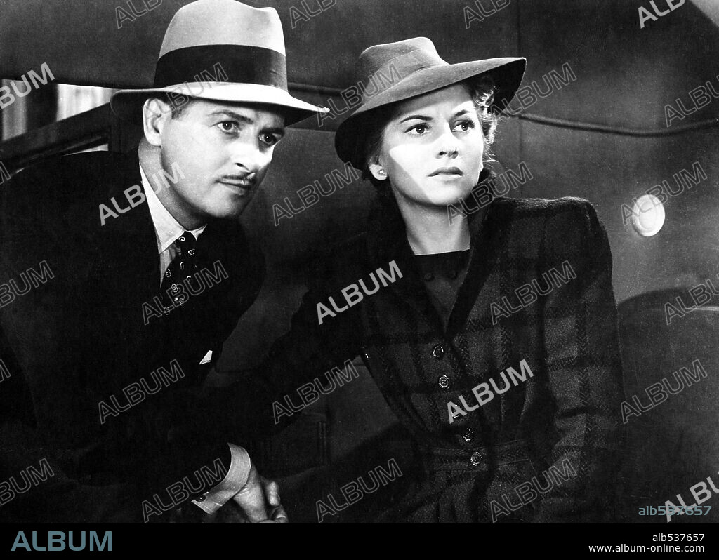 JOAN FONTAINE and REGINALD DENNY in REBECCA, 1940, directed by ALFRED HITCHCOCK. Copyright Selznick International Pictures.