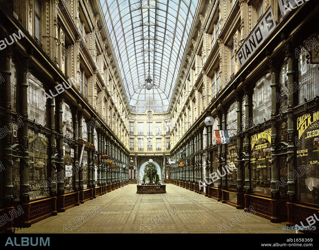 Shopping Arcade, Rotterdam, Holland, 1890-1900. Shops lining both sides of glass-roofed arcade. Netherlands City Trade Retail.