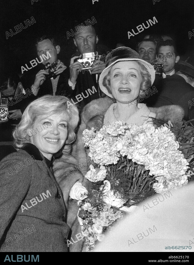 Marlene Dietrich (r) and Hildegard Knef (l) are welcomed as the arrive in Berlin on the 30th of April in 1960. 30/04/1960