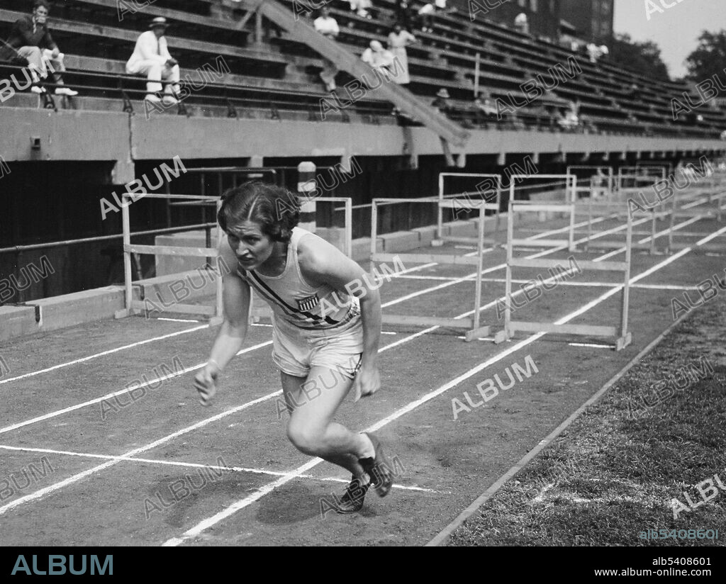 Helen Stephens, the Olympic champion in action. The 18 year old champ tried to break the record for the 200 meter record here in Washington. Helen Herring Stephens (February 3, 1918 - January 17, 1994) was an American athlete. Stephens, nicknamed the Fulton Flash, was a strong athlete in sprint events - she never lost a race in her entire career - and also in weight events such as the shot put and discus throw. She won national titles in both categories. When she was 18, Stephens participated in the 1936 Summer Olympics. She won the 100 meter final,  and anchored the American 4 x 100 meter relay team that won the Olympic title. She retired from athletics shortly after the games and played professional baseball and softball. From 1938-1952, she was the first woman to own and manage a semi-professional basketball team. She was employed for many years in the Research Division of the U.S. Aeronautical Chart and Information Service. In 1993, she was inducted into the National Women's Hall of Fame. She died in 1994 at the age of 75. Harris & Ewing, September 12, 1936.