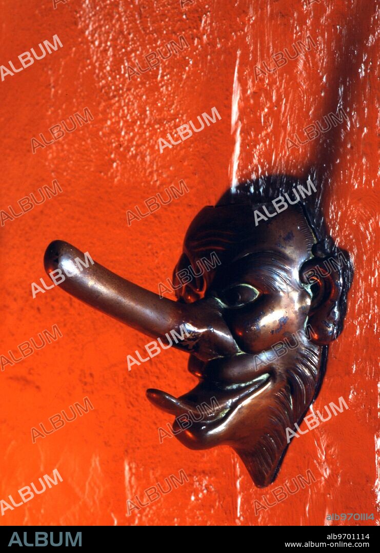 Erotic art - Small bronze demonic mask, with long phallic nose. Used in a wiccan group until the mid-20th century. Private collection. - ©Charles Walker / TopFoto.
