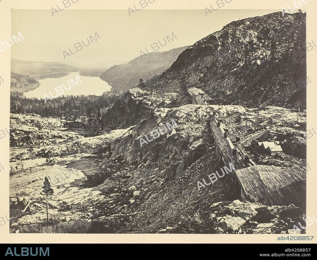ANDREW JOSEPH RUSSELL. Summit of Sierra Nevada, Snow Sheds in Foreground, Donner Lake in the Distance, C. P. R. R. Andrew J. Russell; American, 1830-1902. Date: 1868-1869. Dimensions: 15.4 x 20.4 cm (image/paper); 23.2 x 30.3 cm (album page). Albumen print, pl. XXIX from the album "Sun Pictures of Rocky Mountain Scenery" (1870). Origin: United States.