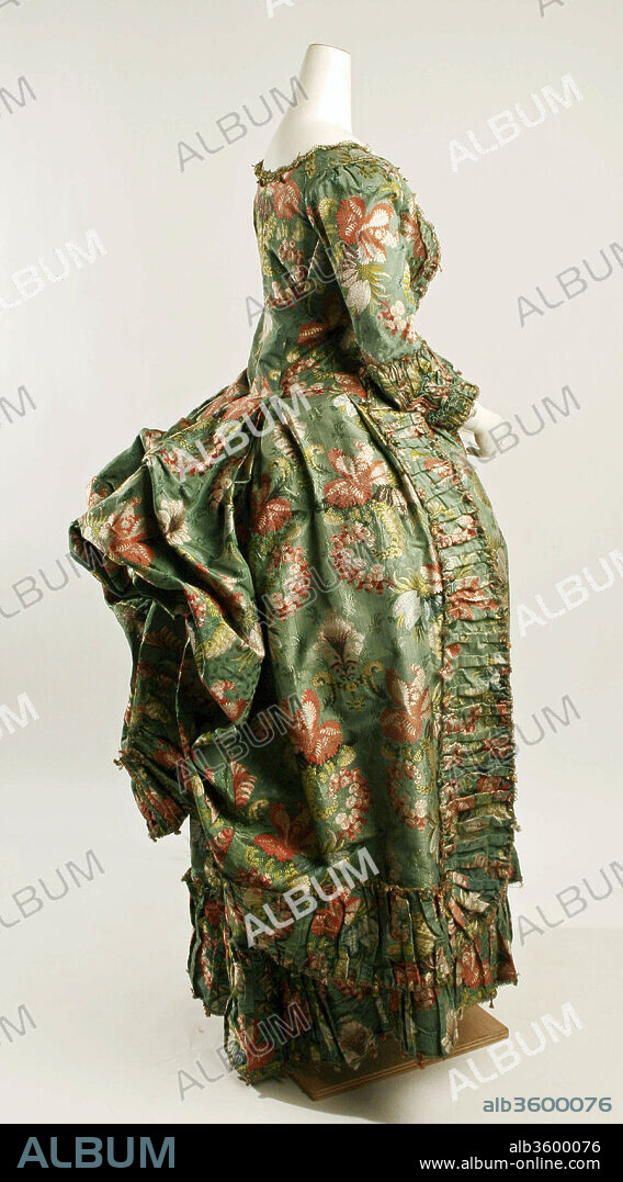 Robe à la Polonaise. Culture: French. Date: 1774-93.
The term robe à la polonaise is often applied to any late-eighteenth-century dress with back drapery, but it should be reserved for a dress with a fitted anglaise back and a skirt that can be drawn up on interior tapes into swags. These light, informal dresses enjoyed great popularity for daywear in the late 1770s and 1780s. "Polish" fashion had appeared earlier in honor of Queen Maria Leczinska, who was a Polish princess before she married Louis XV. The "Polish" styles consisted mainly of gowns trimmed with fur or a brocaded fur pattern. Camisoles, caracos, bonnets, and even men's frock coats were also called à la polonaise at the height of the fashion in 1780.