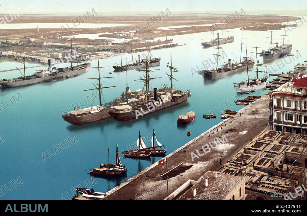 Egypt. Port Said. The port. In 1854 and 1856, Ferdinand de Lesseps obtained a concession from Sa'id Pasha, the Khedive of Egypt and Sudan, to create a company to construct a canal open to ships of all nations. The excavation took some 10 years using forced labour of Egyptian workers during the first years. Some sources estimate that over 30,000 people were working on the canal at any given period, that more than 1.5 million people from various countries were employed, and that thousands of laborers died. The canal opened under French control on 17 November 1869. Although numerous technical, political, and financial problems had been overcome, the final cost was more than double the original estimate. The canal had an immediate and dramatic effect on world trade and it played an important role in increasing European colonization of Africa. Photoglob Company, Detroit Publishing Company, 1905.