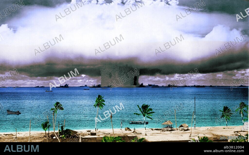 Colorized image of BAKER nuclear test at Bikini Atoll. The nuclear bomb was detonated at 90 feet underwater on July 25th, 1946 as part of Operation Crossroads. The purpose of Operation Crossroads nuclear weapon tests was to investigate the effect of nuclear weapons on naval ships. Gases formed a bubble which rose above the surface. Water filling the cavity formed by the bubble caused a hollow column of water, called the chimney or plume, to rise 6,000 ft (1,800 m) in the air and break through the top of the cloud.