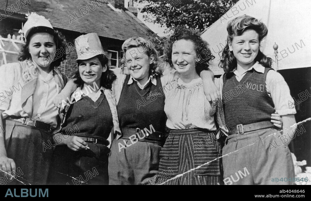Land Army Girls outside Woodhill Road Hostel, Collingham, Nottinghamshire, c1947-1950. Left to right: Jean Day, Edna Fox, Jean Best, Ivy Cooper and Violet Parnham.