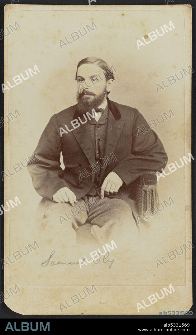 HENRY C. PHILLIPS. Carte-de-visite of Samuel Ely shown in three-quarter portrait. [After his civil war service he did farming and worked as a trader at the Oteo Agency, in Nebraska and as an Agent for the Pawnee Indians.] Ely is seated with his body facing the camera, but his head is turned one quarter to his right and he looks off camera. His hair is parted on the left side and combed smooth to just above his ears and he has a full beard and mustache. His cheeks are tinted pink. Ely wears a dark coat with velvet collar, white shirt, dark bowtie, dark vest, and light pants. A watch chain is visible hanging from his vest buttons. His left elbow is propped on the arm of the chair he sits in white his right hand rests on his right thigh. Handwritten in graphite at the bottom of the print is the name "Samuel Ely". Handwritten in graphite on the back of the photograph is "Sam. S. Ely. / Wisconsin". Printed on the back of the photograph is a mark for H.C. Phillips with the number "8664" written in.