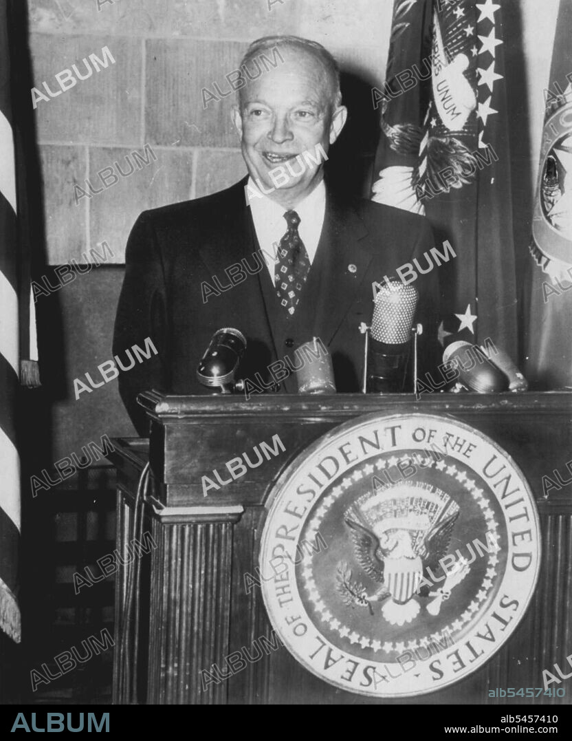 Eisenhower on Religious Program -- President Eisenhower stands behind a desk bearing the presidential seal as he records a message for broadcast today by radio and television on a religious program sponsored by the American Legion. The president's part in the "Back to God" broadcast was filmed at the White House Friday. February 01, 1953. (Photo by AP Wirephoto).