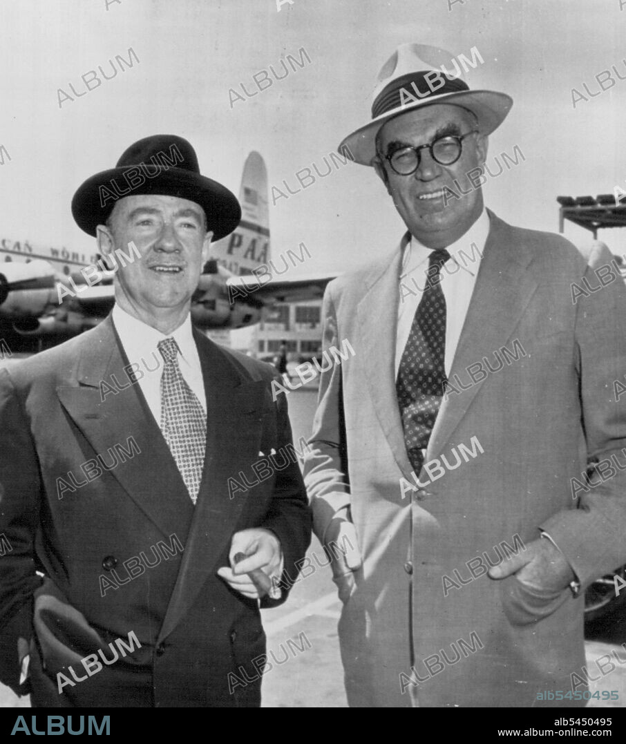 Leave For Security Pact Meeting In Honolulu -- Sir Percy Spender (left), Australia's ambassador to the U.S., and Leslie K. Munro, New Zealand's ambassador, pose just before they boarded a Pan American Strato-Clipper for Honolulu here today. They will represent their governments in the Pacific Mutual Security Pact meeting. Dean Acheson, Secretary of state, will represent the U.S. in the deliberations in Honolulu. August 1, 1952. (Photo by AP Wirephoto).