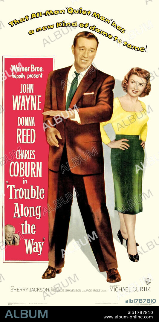 DONNA REED y JOHN WAYNE en UN CONFLICTO EN CADA ESQUINA, 1953 (TROUBLE ALONG THE WAY), dirigida por MICHAEL CURTIZ. Copyright WARNER BROTHERS.