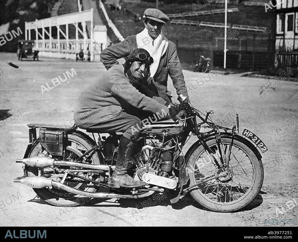 Mk1 Brough Superior 1000cc motorbike, (early 1920s?). JA Watson-Bourne, a motorcycle racer of the early 1920s is on the machine, while company founder George Brough stands behind. Brough's machines were advertised as being the 'Rolls-Royce' of motorcycles. Expensive and powerful, they were mostly handmade, many powered by JAP (JA Prestwich) engines, and some by Matchless.