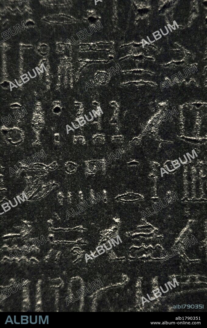 The Rosetta Stone. Fragment of a black granite stele with an inscription in different languages __of a decree of Ptolemy V Epiphanes king. Hieroglyphic scripture. Detail. Ptolemaic era. 196 BC. British Museum. London. United Kingdom.