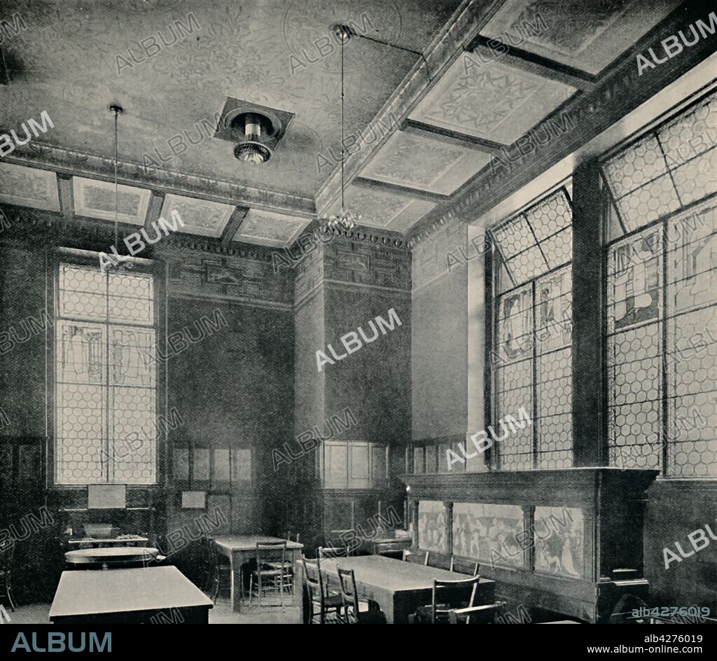 'The Green Dining-room at South Kensington Museum', c1870. Interior of what is now the Victoria & Albert Museum in London. Decoration designed by William Morris (1834-1896). The windows of bullseye bottle glass were conceived by Philip Webb, with figures in stained glass made by Edward Coley Burne-Jones (1833-1898). From "Modern Art Monographs".