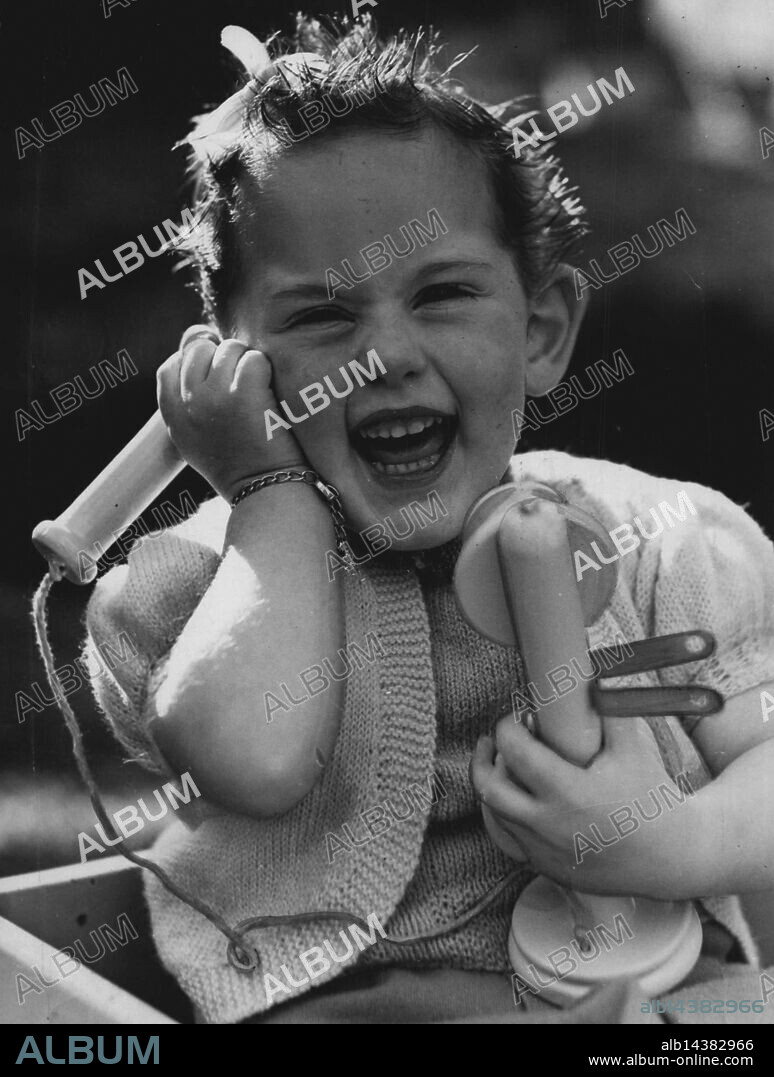 Pretty Diana Raymond, of Randwick, makes a charming study as she pretends to ring the tradesmen on her toy telephone. She frequently carriers on imaginary conversations with friends and relatives. Below (to the butcher): "Four pounds of chops, please." August 07, 1946.