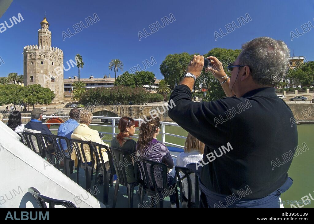 Sightseeing cruise on the river Guadalquivir and the Gold tower, Seville, Region of Andalusia, Spain, Europe.