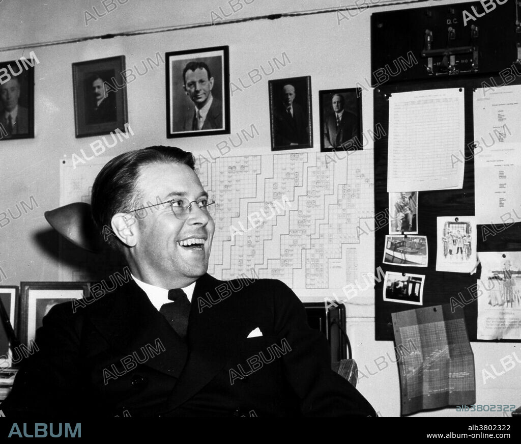 Lawrence in his office, November 22, 1939. Ernest Orlando Lawrence (August 8, 1901 - August 27, 1958) was an American physicist and Nobel Laureate, known for his invention, utilization, and improvement of the cyclotron atom-smasher beginning in 1929, based on his studies of the works of Rolf Wideroe, and his later work in uranium-isotope separation for the Manhattan Project. Lawrence had a long career at the University of California, Berkeley, where he became a Professor of Physics. In 1939, Lawrence was awarded the Nobel Prize in Physics for his work in inventing the cyclotron and developing its applications. After the war, Lawrence campaigned extensively for government sponsorship of large scientific programs. Lawrence was a forceful advocate of "Big Science" with its requirements for big machines and big money. He'd died in 1958 at the age of 57. After his death, the Regents of the University of California voted to rename two of the university's nuclear research sites after Lawrence: the Lawrence Livermore and Lawrence Berkeley Laboratories. Chemical element number 103, discovered at LBNL in 1961, is named "lawrencium" in his honor.