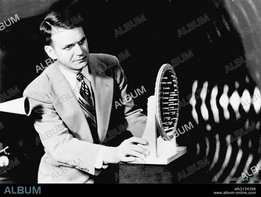 Bell Telephone Laboratories:  June 20, 1950. F.K. Harvey demonstrates the focusing of of an acoustic lens on sound waves emitted from the horn at left.