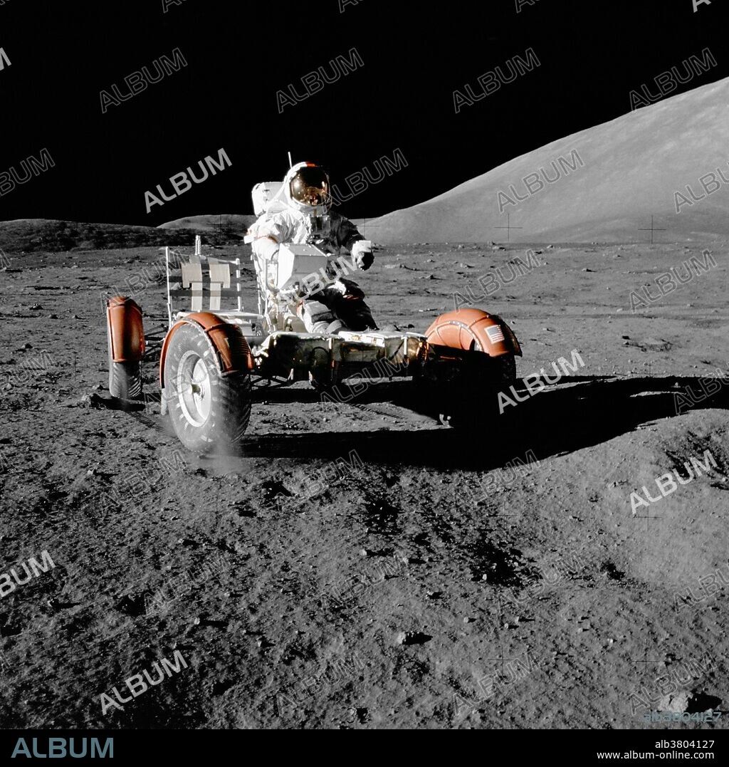 Astronaut Eugene A. Cernan, commander, makes a short checkout of the Lunar Roving Vehicle (LRV) during the early part of the first Apollo 17 extravehicular activity (EVA) at the Taurus-Littrow landing site, December 11, 1972. This view of the LRV is prior to loading. Equipment later loaded onto the LRV included the ground-controlled television assembly, the lunar communications relay unit, hi-gain antenna, low-gain antenna, aft tool pallet, lunar tools and scientific gear. This photograph was taken by scientist-astronaut Harrison H. Schmitt, lunar module pilot. The mountain in the right background is the east end of South Massif.