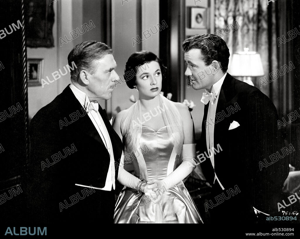 LEO G. CARROLL, ROBERT WALKER and RUTH ROMAN in STRANGERS ON A TRAIN, 1951, directed by ALFRED HITCHCOCK. Copyright WARNER BROTHERS.