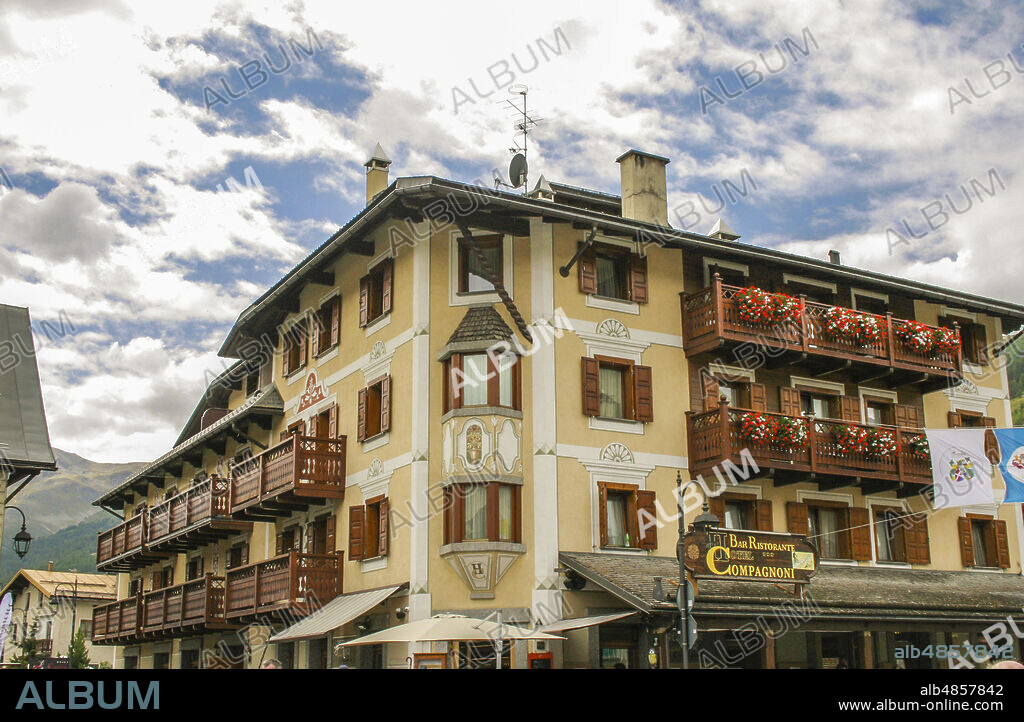 Livigno, province of Sondrio, Valtellina, Lombardy, Italy. Livigno (1816 meter altitude), duty-free area, is part of the Alta Valtellina mountain community and is a winter and summer resort in the Alps. A typical building with wooden fixtures and flowered balconies.