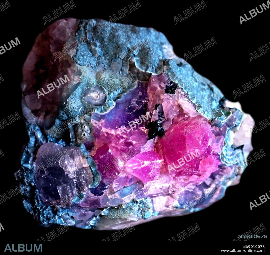 A sample of blue fibrous radiating with pink and white calcite. Dated 21st Century.