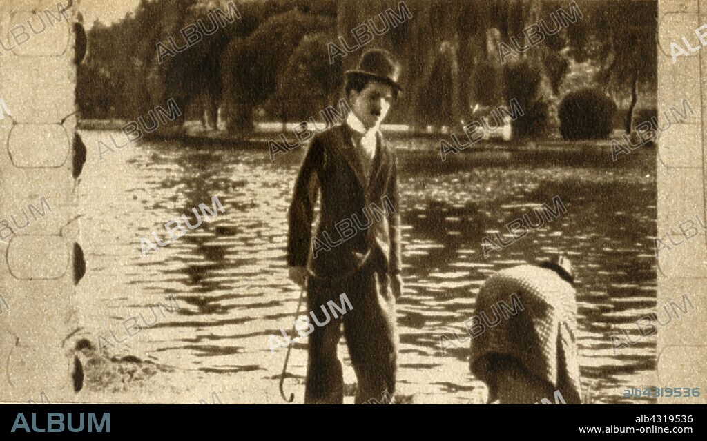 Charlie Chaplin, 1914, (1933). British actor, producer, writer and director Charlie Chaplin (1889-1977) in a still from the silent film comedy "Recreation", (1914). From "The Pageant of the Century". [Odhams Press Ltd, 1933].