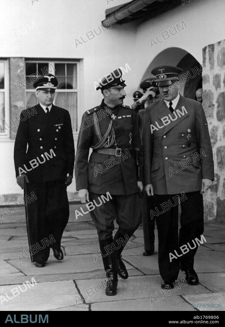 Adolf Hitler with Boris III of Bulgaria and Joachim von Ribbentrop. During a diplomatic meeting, the Chancellor of the Third Reich Adolf Hitler walking beside Boris III, Tsar of Bulgaria, followed by the Foreign Minister of the Third Reich Joachim von Ribbentrop. Berchtesgaden, 7th June 1941.