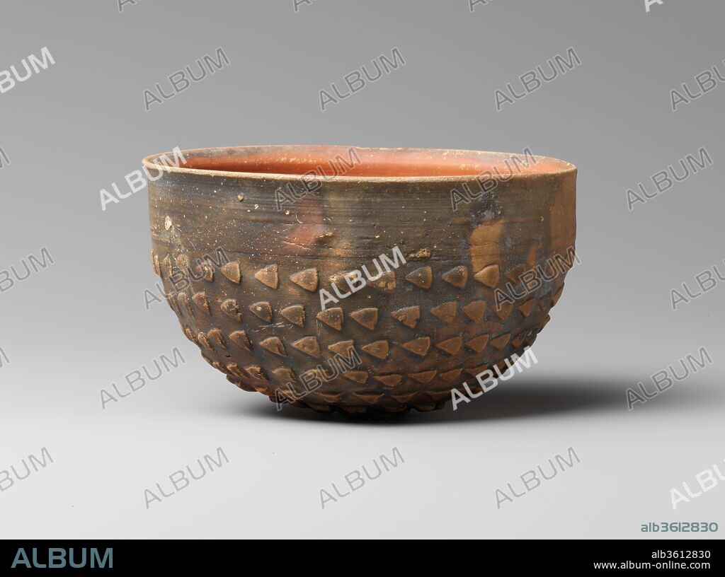 Terracotta Megarian bowl. Culture: Greek. Dimensions: h. 2 15/16 in. (7.5 cm); d. 5 in. (12.7 cm). Date: ca. late 3rd-mid 1st century B.C..
This bowl was probably made in Cyprus by a local potter seeking to replicate the mold-made ware that was being produced contemporaneously in Athenian workshops.