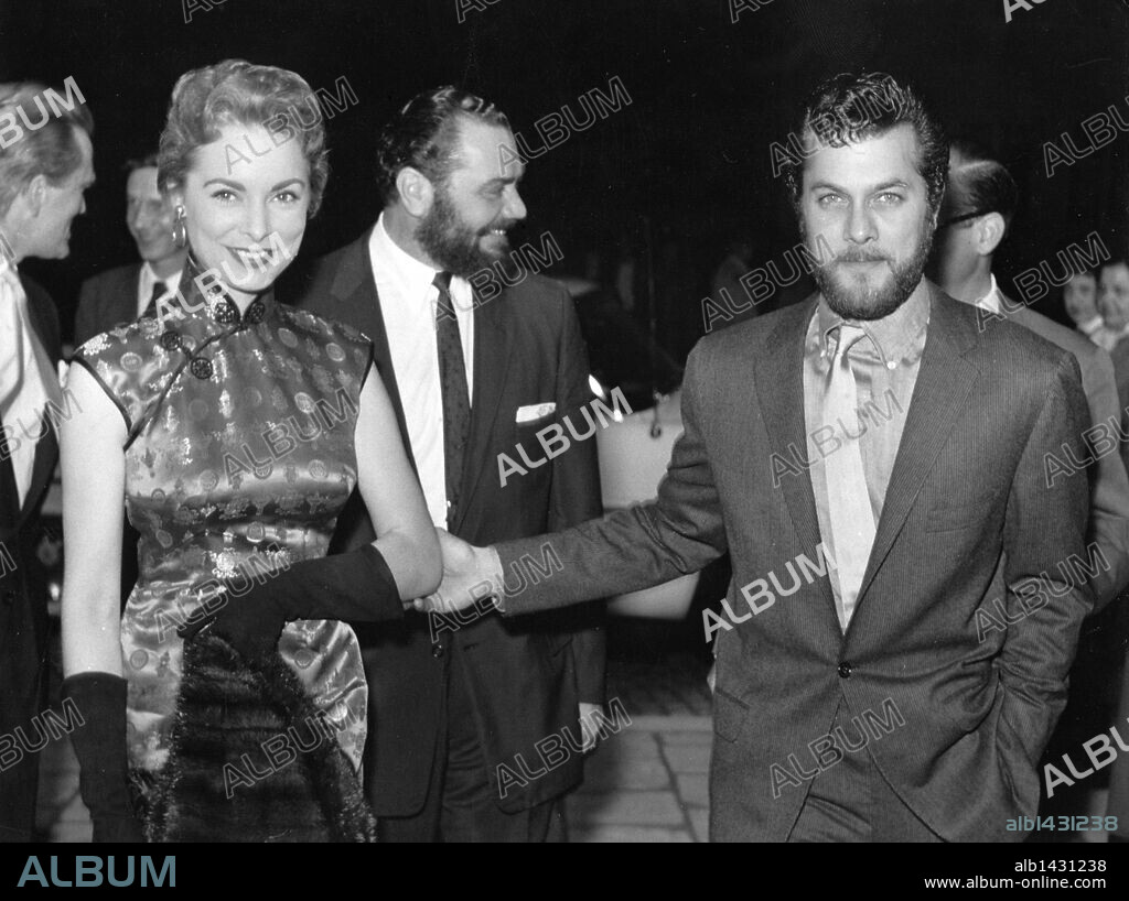 Jan 01, 1958 - Munich, GERMANY - American actor TONY CURTIS and his first wife JANET LEIGH after shooting 'The Vikings'. In the background - ERNEST BORGNINE. Originally dismissed as little more than a pretty boy, Tony Curtis overcame a series of bad reviews and undistinguished pictures to emerge as one of the most successful actors of his era, appearing in a number of the most popular and acclaimed films of the late '50s and early '60s. (Credit Image: Â© Keystone Pictures/ZUMA Press) RESTRICTIONS. 1958