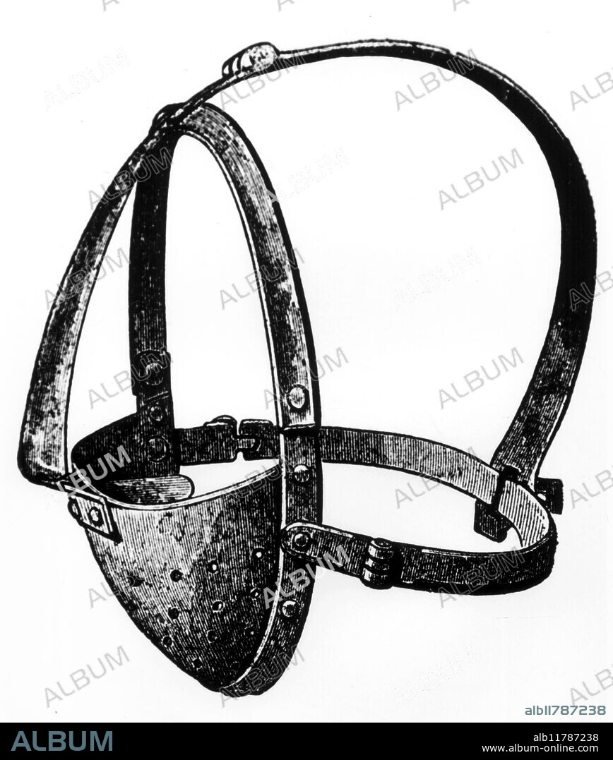 A scold's bridle or witch-branks, used to silence people by blocking the tongue (note the sharp insert, which would go into the mouth, over the tongue). Widely used during the witchcraft period. 19th century, from Pettifer's PUNISHMENTS IN FORMER DAYS. - © TopFoto / Fortean.