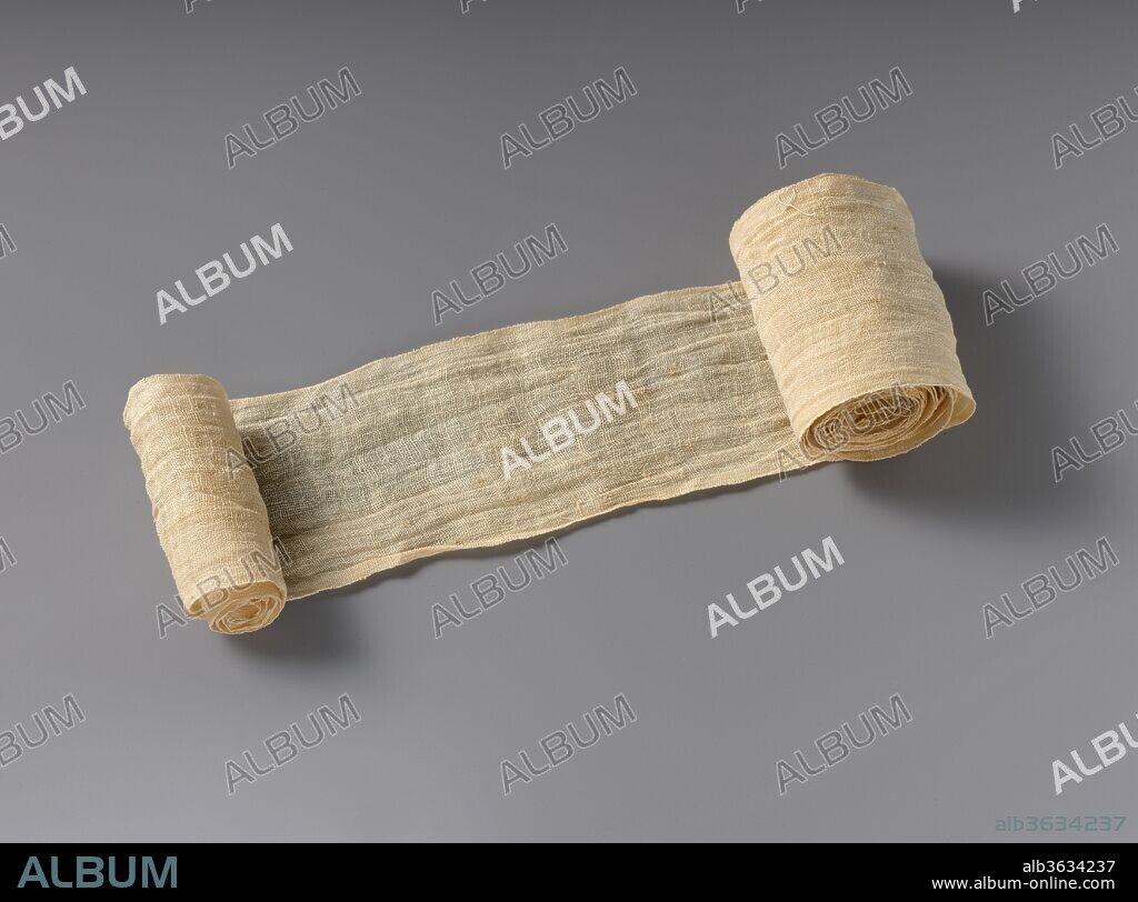 Mummy Bandage from Tutankhamun's Embalming Cache. Dimensions: L. 165 cm (64 15/16 in.); W. 6 cm (2 3/8 in.). Dynasty: Dynasty 18. Reign: reign of Tutankhamun. Date: ca. 1336-1327 B.C..
In December 1907 Theodore M. Davis, a wealthy American who was funding excavations in the Valley of the Kings, discovered a small pit near the tomb of Seti I. Inside the pit were approximately a dozen large sealed whitewashed storage jars (09.184.1). Among other things, the jars contained bags of natron (a kind of salt),  pieces of linen with hieratic inscriptions dated to Years 6 and 8 of a king named Tutankhamun (throne name Nebkheperure).  At the time, almost nothing was know about Tutankhamun, and Davis declared that he had discovered the king's tomb.
Davis received a number of the jars and their contents in the division of finds and, in 1909, he gave most of his share to the Metropolitan Museum.  It was only later that Herbert Winlock, the field director of the Museum's excavations at Thebes, realized that the natron and linen were embalming refuse from the mummification of Tutankhamun.
In ancient Egypt, linen was a valuable commodity used for clothing, bedding, blankets, cushions and other purposes. when it became too worn to be used by the living, it was put asside and used for mummification. In general, the bandages used to wrap a mummy were torn from old old linen sheets, but a number of the bandages from Tutankhamun's embalming cache, including this one that has a selvedge edge on both sides, were specially woven for this purpose.