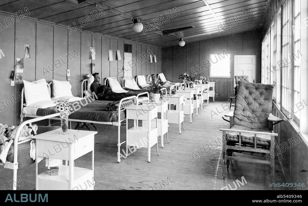 Interior of a tuberculosis sanitarium with some bedridden patients at Mountain Sanatorium, Hamilton, Ontario, Canada, 1918.