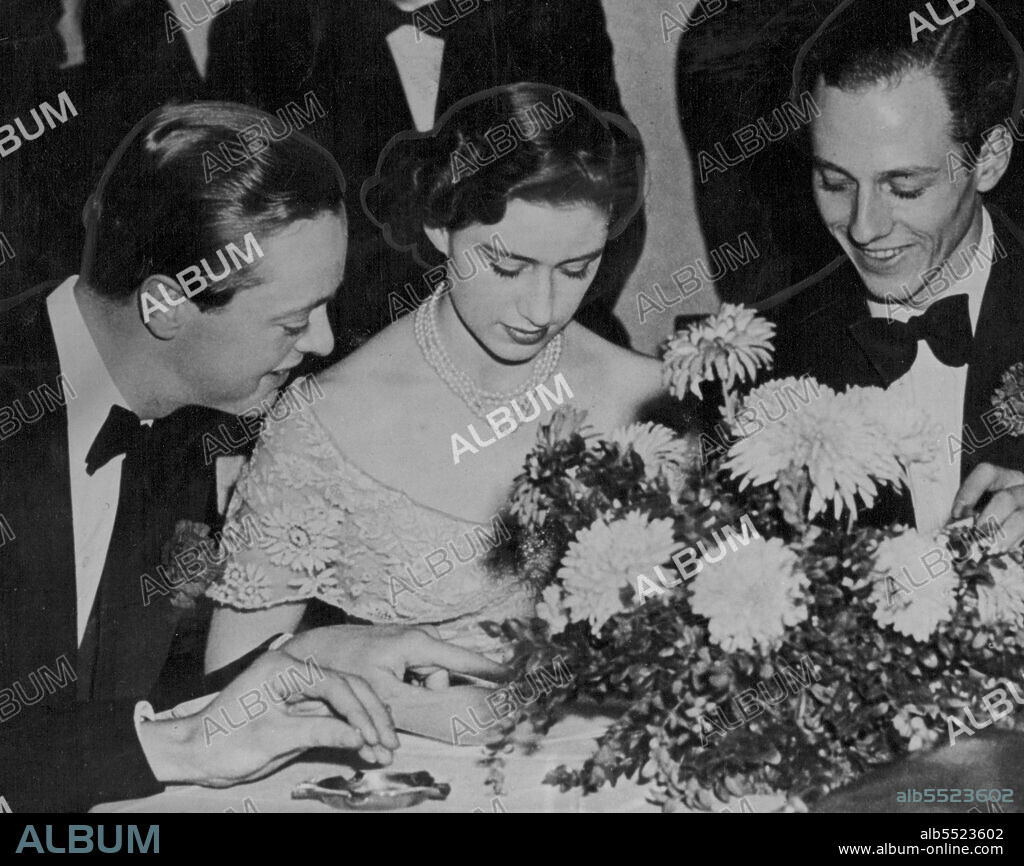 Princess Margaret At Nurses' Ball - Princess Margaret has the Marquess of Blandford (left) as Table Companion during the British Empire Nurses' War Memorial Fund "Thank-You Nurse" ball, held last night, December 3. At British Medical Association House, Tavistook Square, London. Man at right of Princess unidentified. December 13, 1948. (Photo by Associated Press Photo).