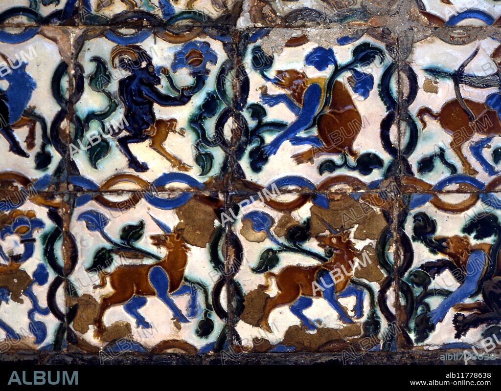 Emblematic figures of two unicorns, and two satyr-like goats. Tiles on the walls of the garden of the Alcazar, Seville, Spain.