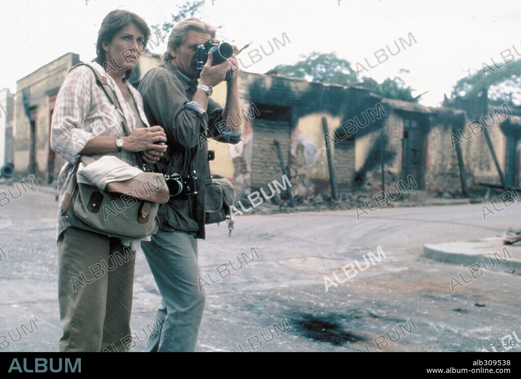 JOANNA CASSIDY and NICK NOLTE in UNDER FIRE, 1983, directed by ROGER SPOTTISWOODE. Copyright ORION PICTURES.