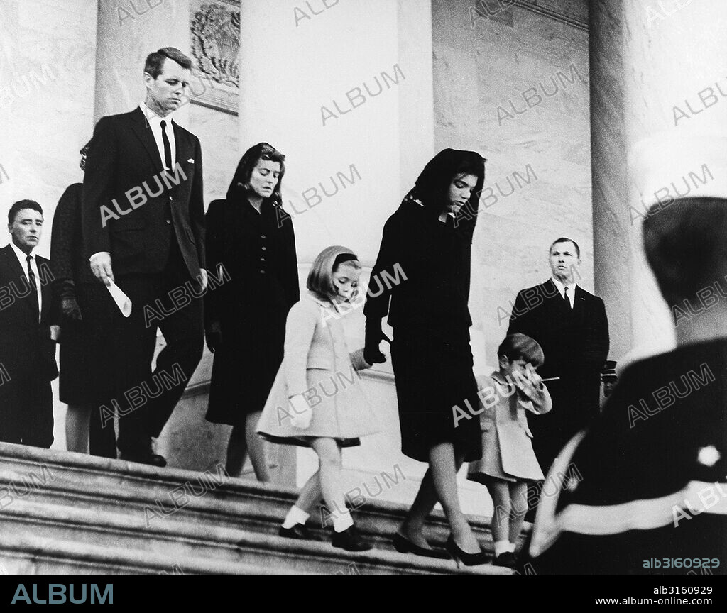 Washington, D.C.: November 25, 1963 The President's family leaves the Capitol after the funeral ceremony. Front row: Caroline Kennedy, Jacqueline Bouvier Kennedy, John F. Kennedy, Jr. (2nd row) Attorney General Robert F. Kennedy, Patricia Kennedy Lawford (hidden) Jean Kennedy Smith (3rd Row) Peter Lawford.