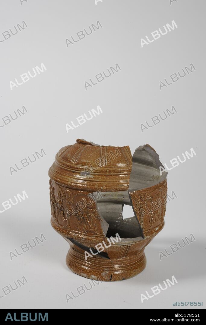 Anonymous, last quarter of the 16th century, stoneware, salt glaze, General: 13 x 10.8cm 130 x 108mm, making music, figure, dancing, Fragment of a jug of Rhenish stoneware covered with brown salt glaze labeled with a depiction of dancing couples and a music group separated by arcs and cariatids. The fragment has a cylindrical shape tapering from below and above, resembling a farmer's jug. At the bottom an old label with cat. No. 145 on it, 1979.