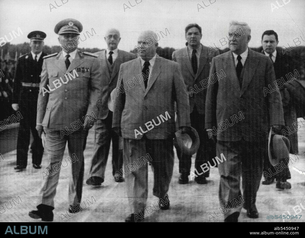 All In Step -- Every Body's in step as Marshal Tito of Yugoslavia, left, Marches with his soviet guests across Tarnac at Belgrade Airport after they hall arrived on a friendship visit to Yugoslavia today, May 26. Nikita Khrushchev, secretary of the Russian visiting delegation at right is the Soviet Prime Minister, Marshal Nikolai Bulganin. At right in the second row is Andrei Gromyko, Deputy Foreign Minister. May 26, 1955. (Photo by Associated Press Photo).