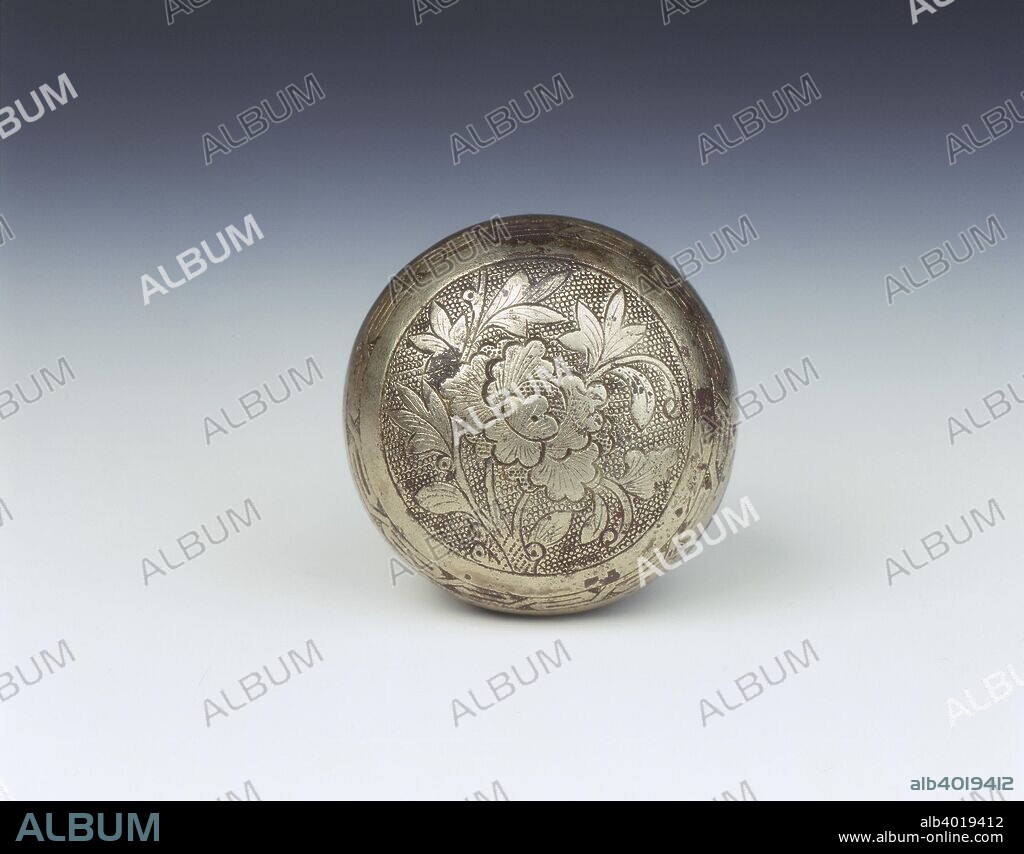 Silvered bronze covered box with peony and angular key-fret,  Late Tang-Northern Song dynasty, China, 10th-11th century. A small circular silvered bronze box decorated with an open peony flower spray with leaves. The decoration appears on a circular ring-punched ground, with a band of angular key fret surrounding the medallion. The base section has a band of narrow incised pointed petals around the foot ring with incised highlights on a plain background.