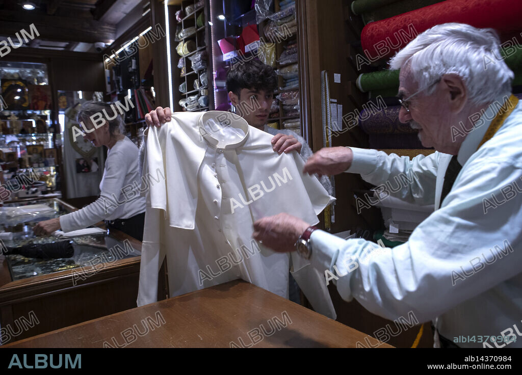 Vatican, Rome - May 6, 2025.Tailor Raniero Mancinelli and his nephew Lorenzo Di Toro, make the finishing touches to the last of the three cassocks, sewn in three different sizes, that the new pontiff will wear on the day of his election. Raniero Mancinelli, 86, has his atelier in Borgo Pio in Rome, and has dressed three different Popes, John Paul II, Benedict XVI and Francis. (Credit Image: © Maria Grazia Picciarella/ROPI via ZUMA Press).