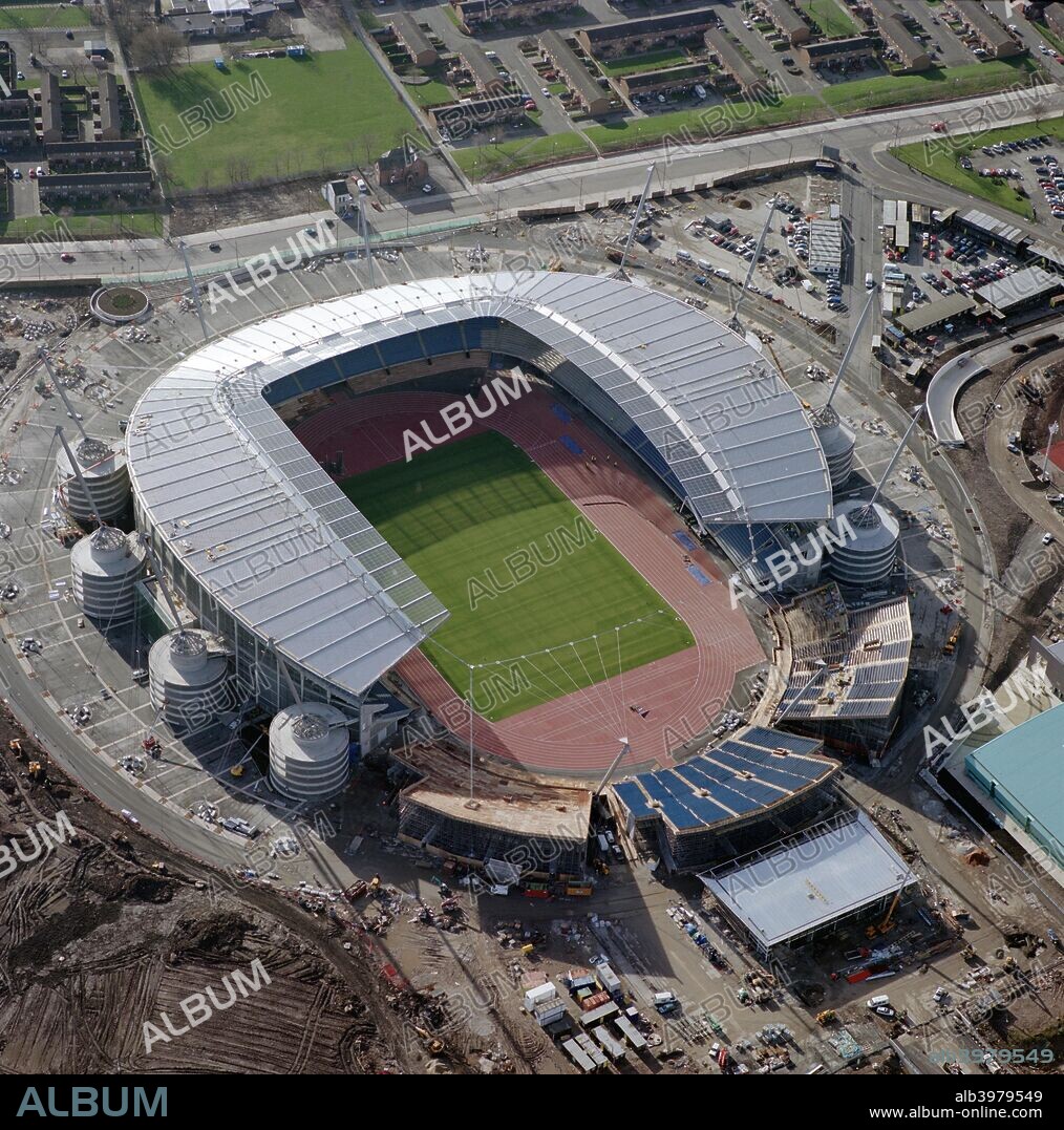 City of Manchester Stadium under construction, February 2002. Also known as Eastlands, the stadium was built as the venue for the 2002 Commonwealth Games. It was then redeveloped, with the running track removed and a new north stand built for use as a 48,000 seat football ground for Manchester City FC, who moved in in 2003. In 2011 the ground was renamed the Etihad Stadium after an agreement with the club's sponsor, Etihad Airways.