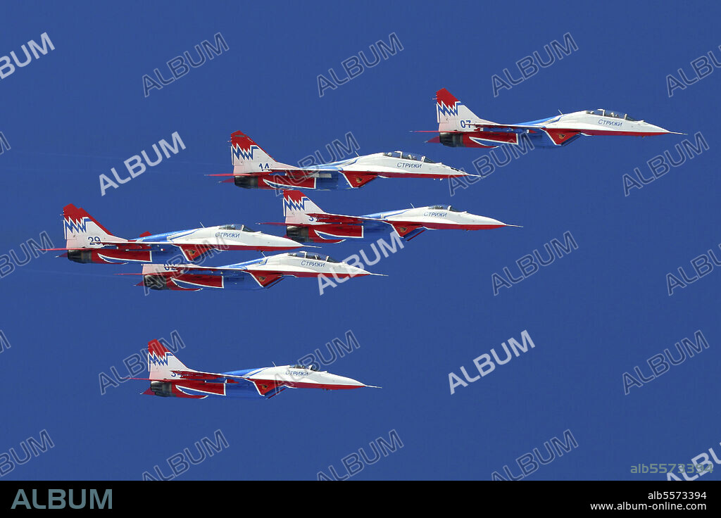 MiG-29UB jet fighters of the Russian Swifts aerobatic team performing training flight, Kubina, Russia.