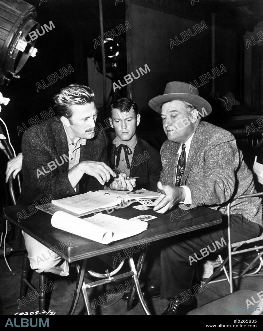 EARL HOLLIMAN, KIRK DOUGLAS and MAX TERHUNE in GUNFIGHT AT THE O. K. CORRAL, 1957, directed by JOHN STURGES. Copyright PARAMOUNT PICTURES.