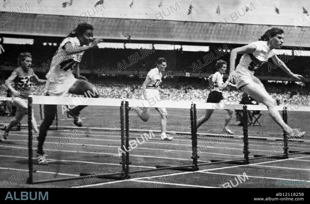 OLYMPIC HURDLES. Centa Gastl ( Germany ) , on right , wins the first heat of the Women ' s 80 metres hurdles from Cuba ' s Bertha Diaz and Britain ' s Carole Quinton ( right, background ) . Fourth was Barbara Meuller (USA) , in centre , and fifth , Milena Greppi , of Italy . 27th November 1956.